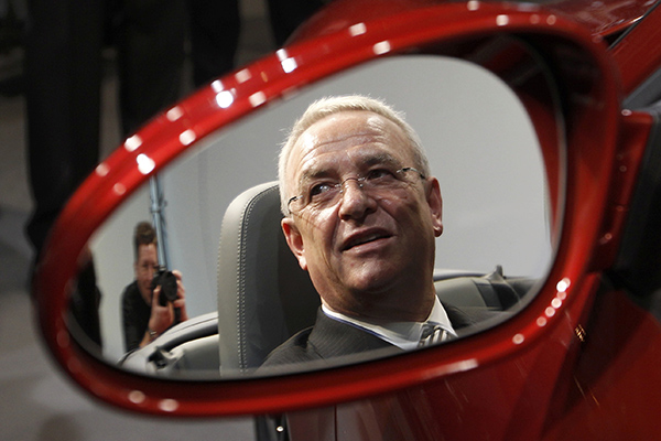 File photo of Volkswagen AG's CEO Winterkorn reflected in a mirror as he sits in a Porsche 911 Carrera Sports Car after the company's annual news conference in Stuttgart